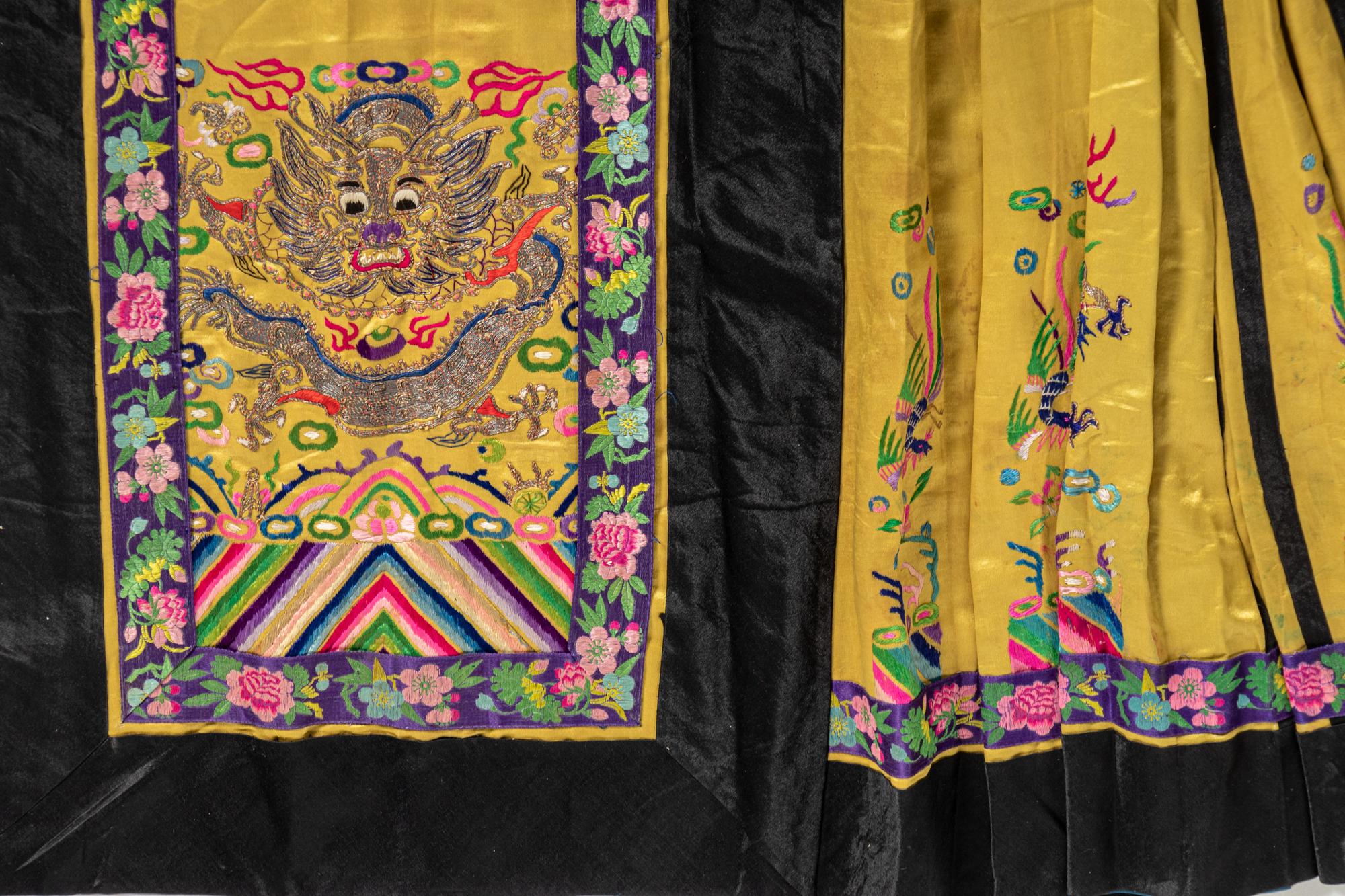 A Chinese Lady's Embroidered Silk Jacket and A Yellow Ground Silk Apron Skirt