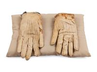 [LINCOLN ASSASSINATION]. A pair of stained leather gloves carried by President Abraham Lincoln at Ford's Theatre on the night of his assassination, 14 April 1865.