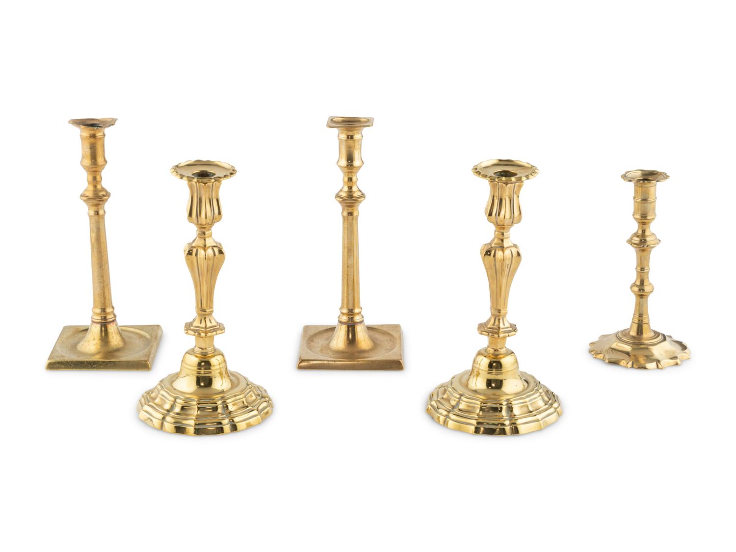 A Group of Five Brass Candlesticks