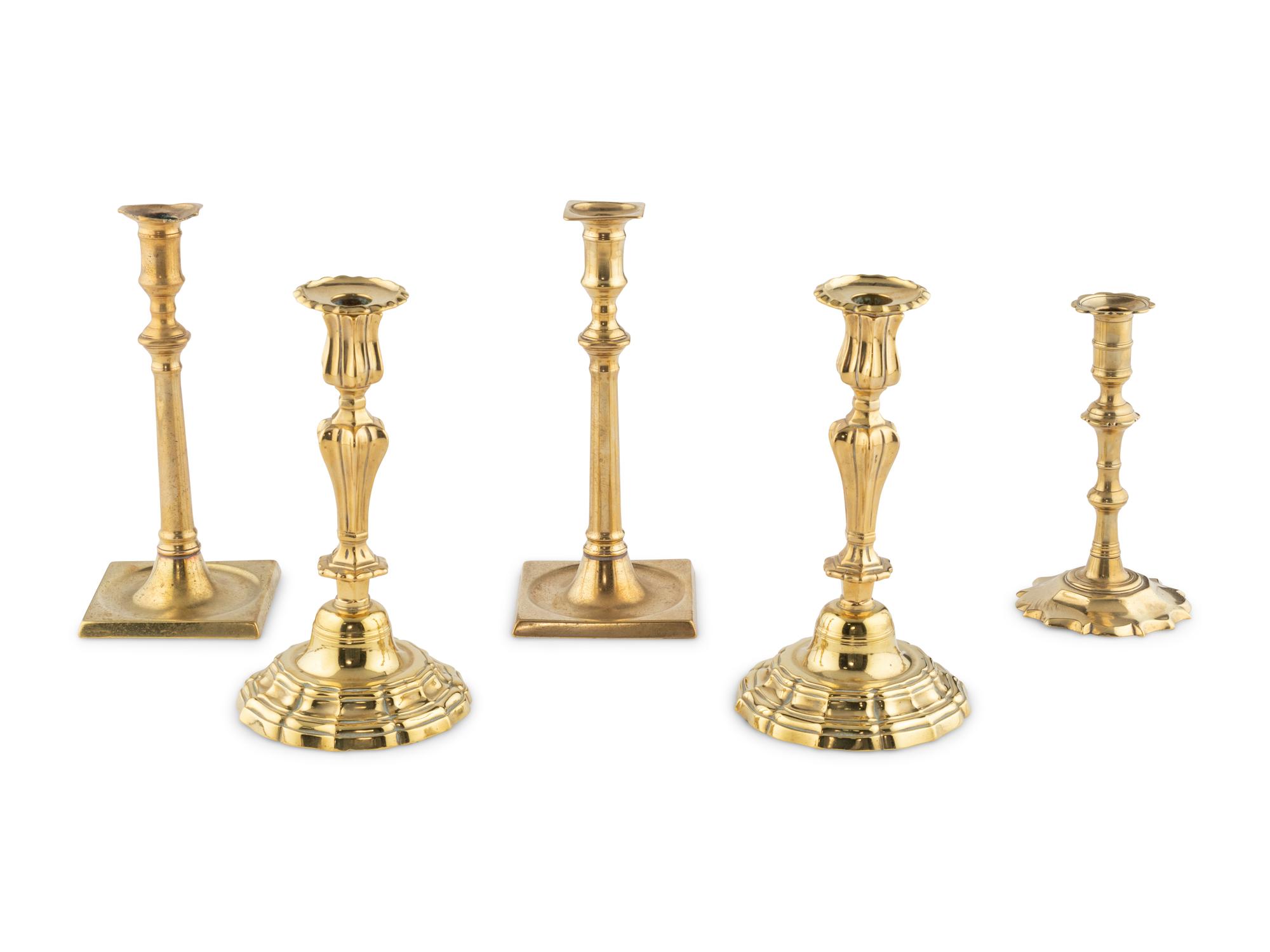 A Group of Five Brass Candlesticks
