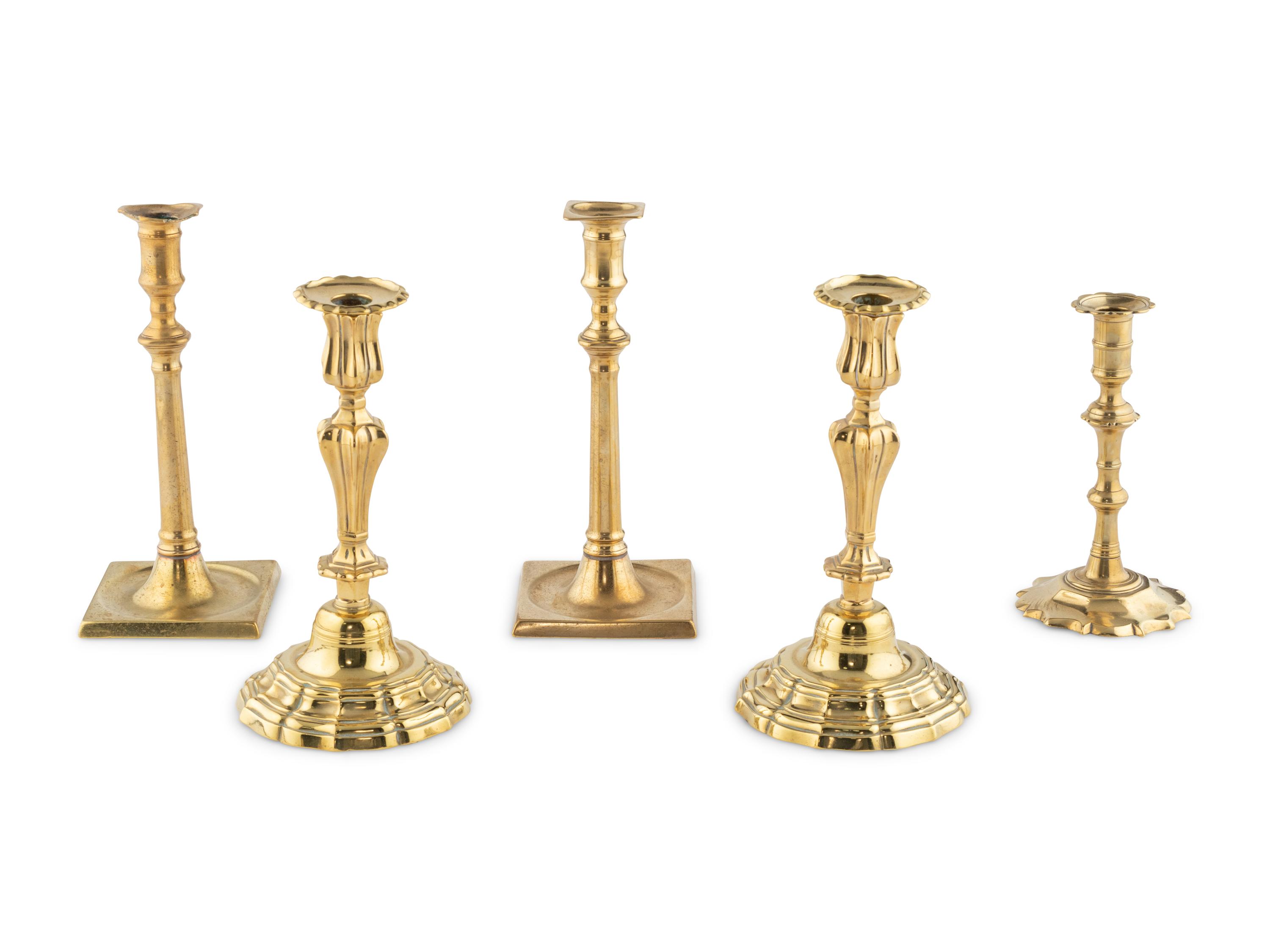 A Group of Five Brass Candlesticks