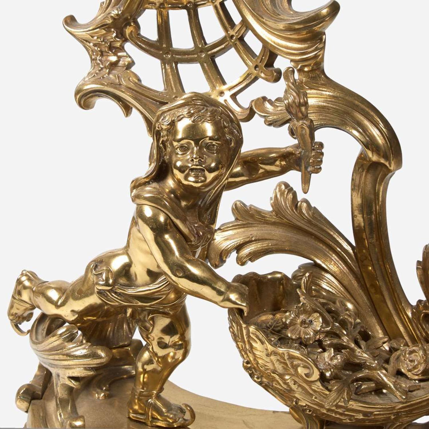 A pair of Louis XVI style gilt bronze chenets late 19th century