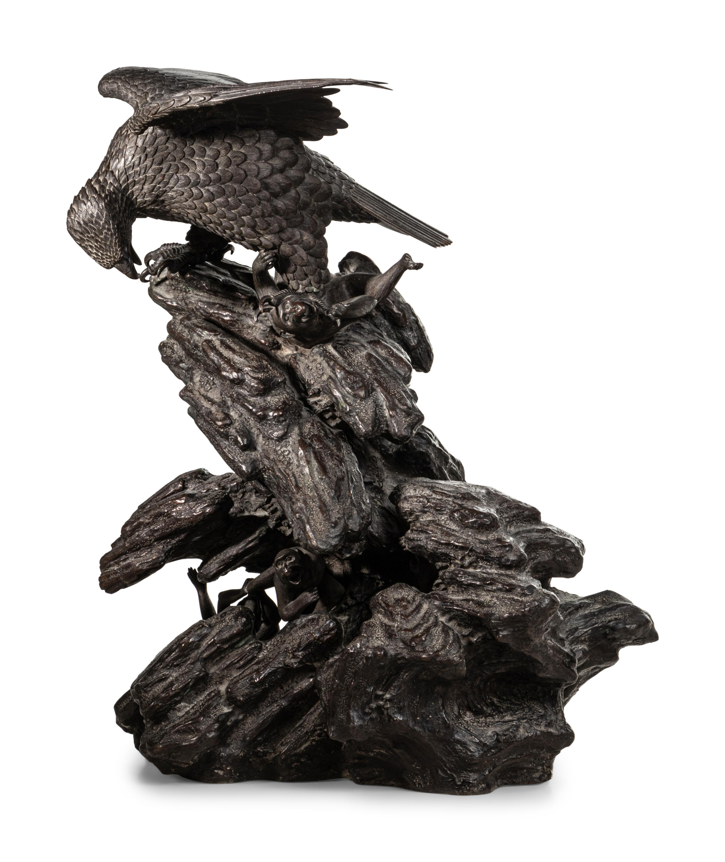 A Japanese Bronze Figural Group of a Hawk Hunting Monkeys