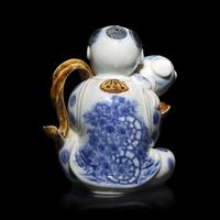 A Japanese Hirado Porcelain 'Boy and Puppy' Ewer, 19th Century — 日本江戶-明治時期 平戶燒抱犬童子執壺