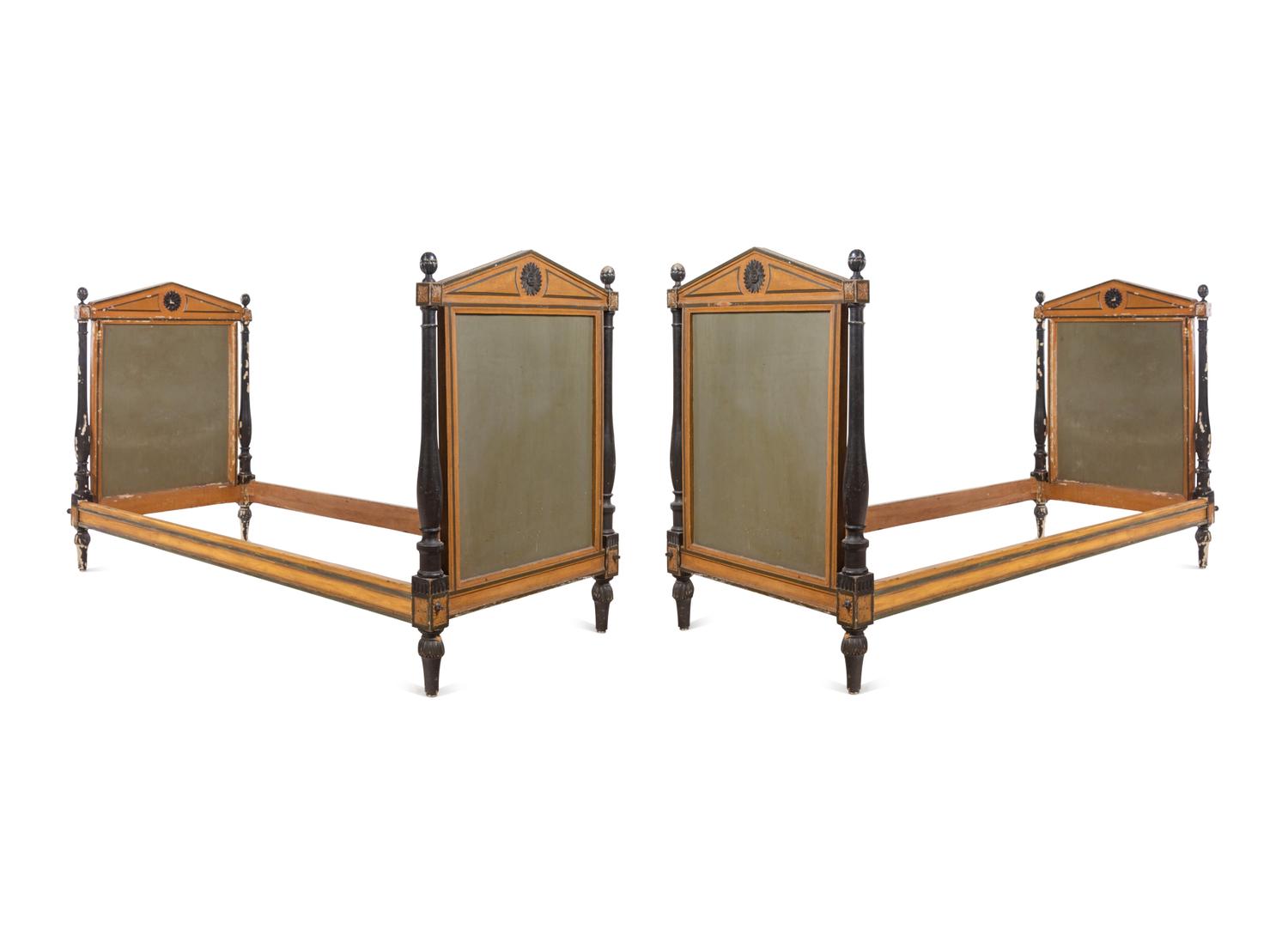 A Pair of Directoire Painted and Parcel Ebonized Daybeds