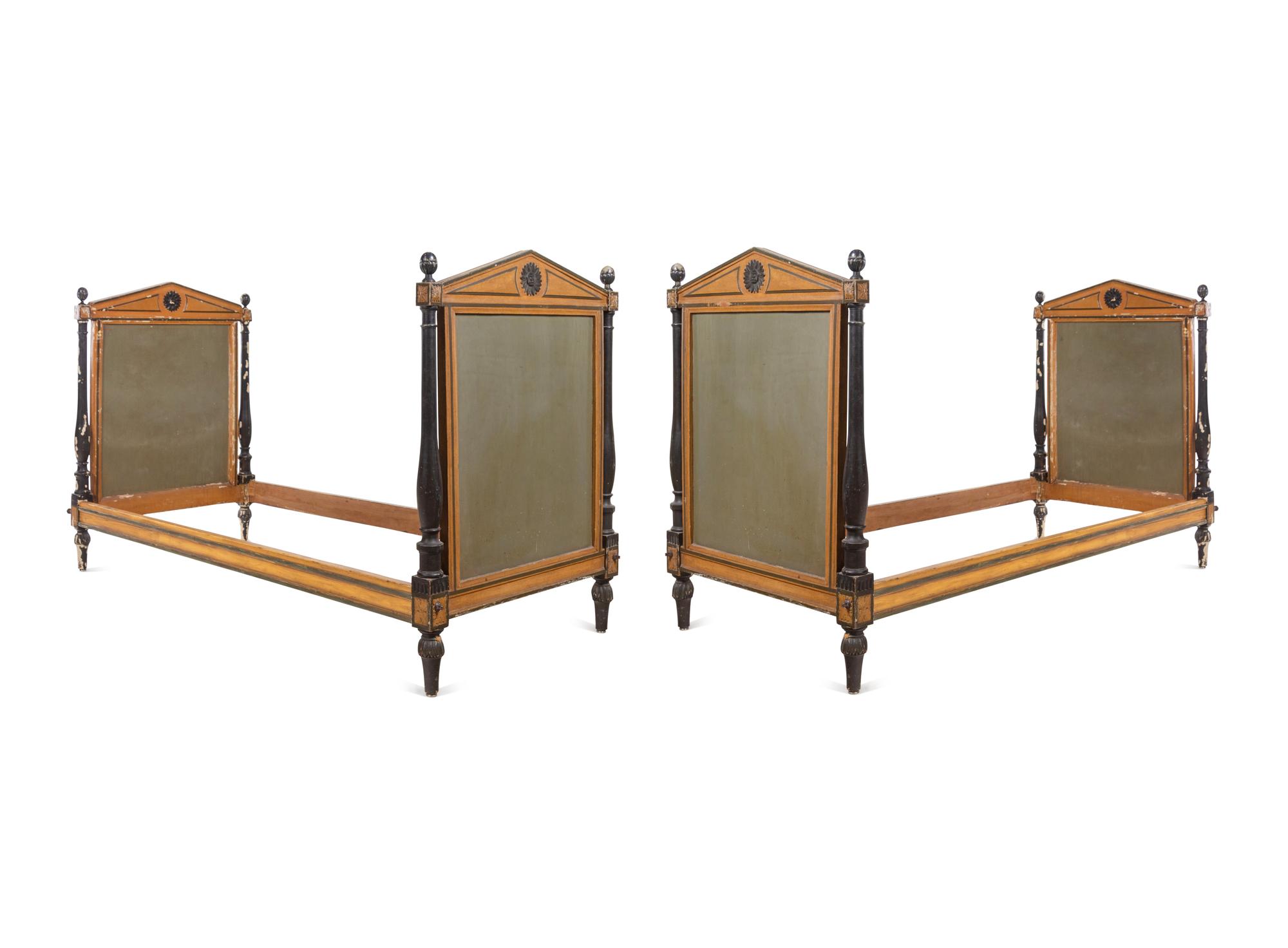A Pair of Directoire Painted and Parcel Ebonized Daybeds