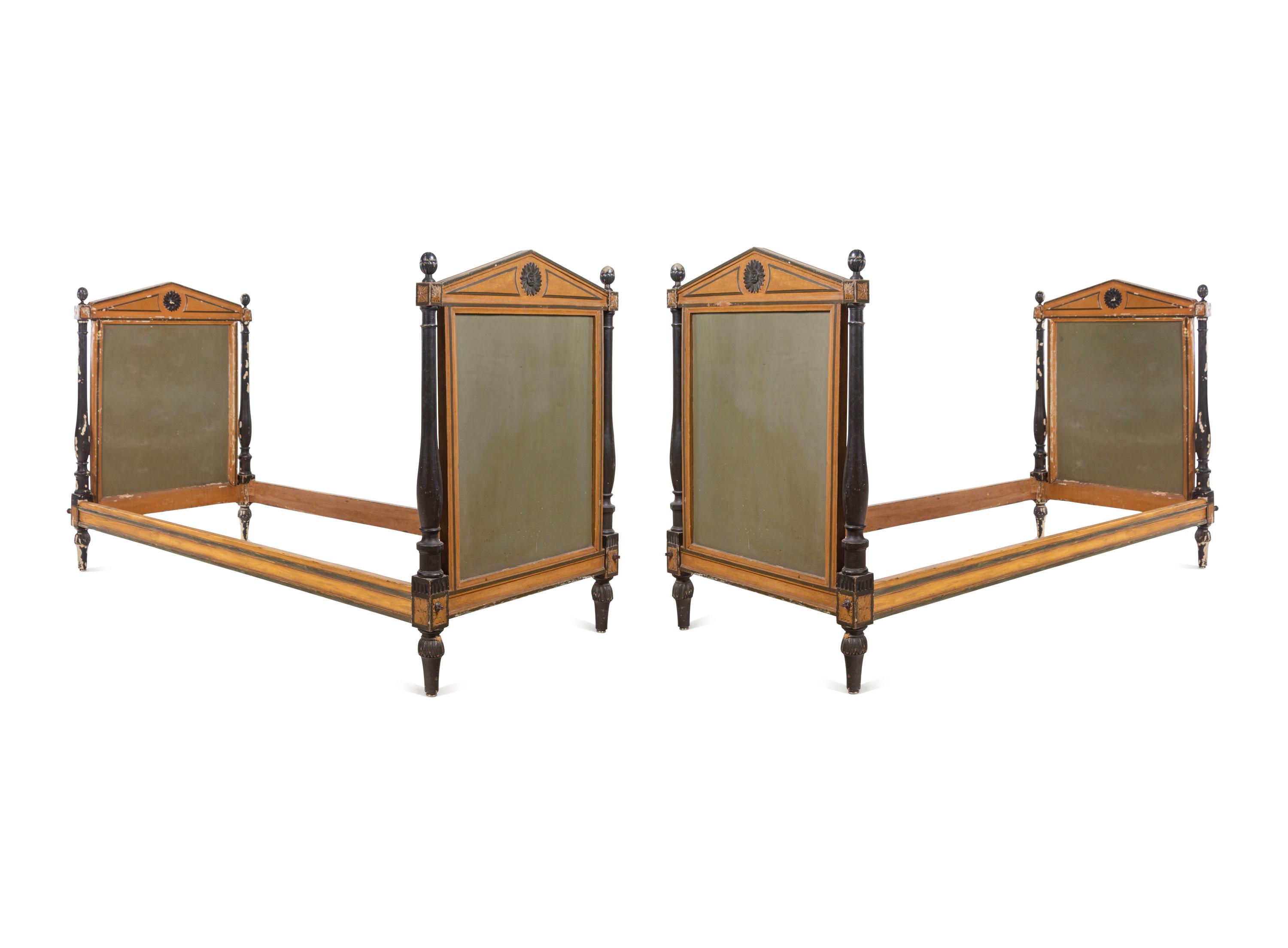 A Pair of Directoire Painted and Parcel Ebonized Daybeds