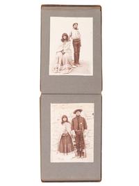 [NATIVE AMERICANS]. JONES, John Edward (1863-1922), photographer. Album containing 50 photographs of the San Carlos Indian Agency, including Apache civilians and police, agency buildings and dwellings, and scenic views. Ca 1904.
