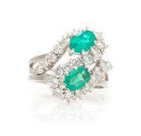 An 18 Karat White Gold, Emerald and Diamond Ring, 6.50 dwts.