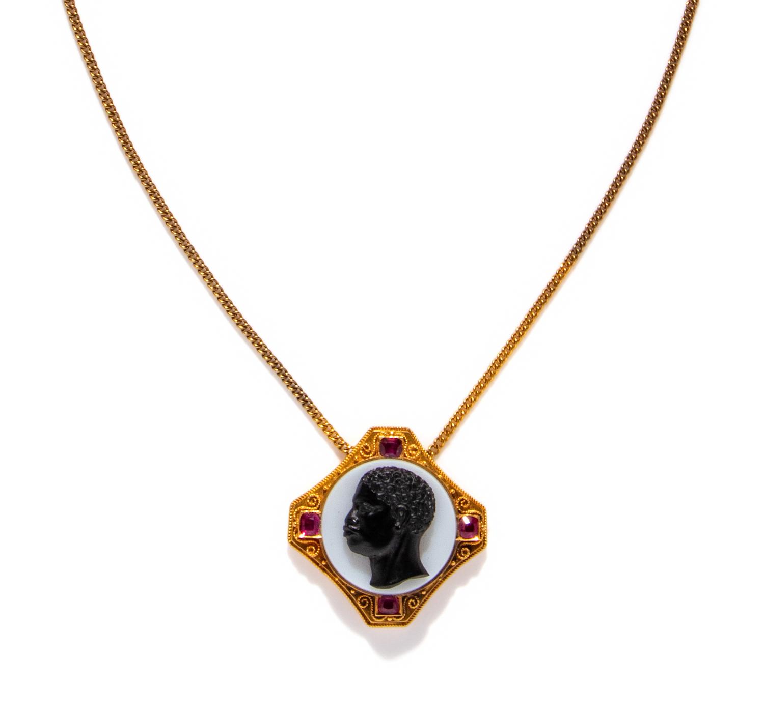 A Neoclassical Gold, Rubie, and Onyx Cameo Pendant with the Portrait Head of a Moore — with a gold chain