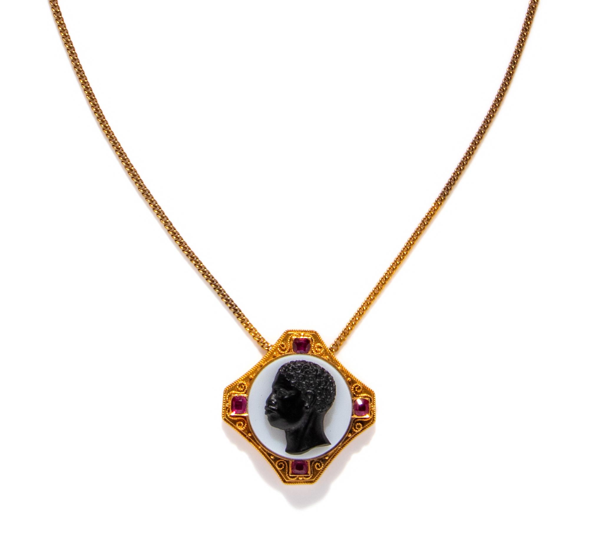 A Neoclassical Gold, Rubie, and Onyx Cameo Pendant with the Portrait Head of a Moore — with a gold chain