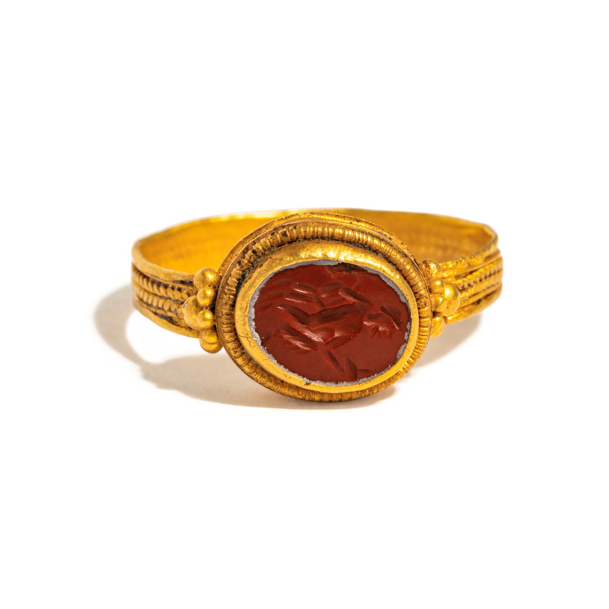 A Roman Gold and Jasper Finger Ring with a Dancing Satyr