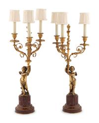 A Pair of French Gilt Bronze and Marble Three-Light Figural Candelabra