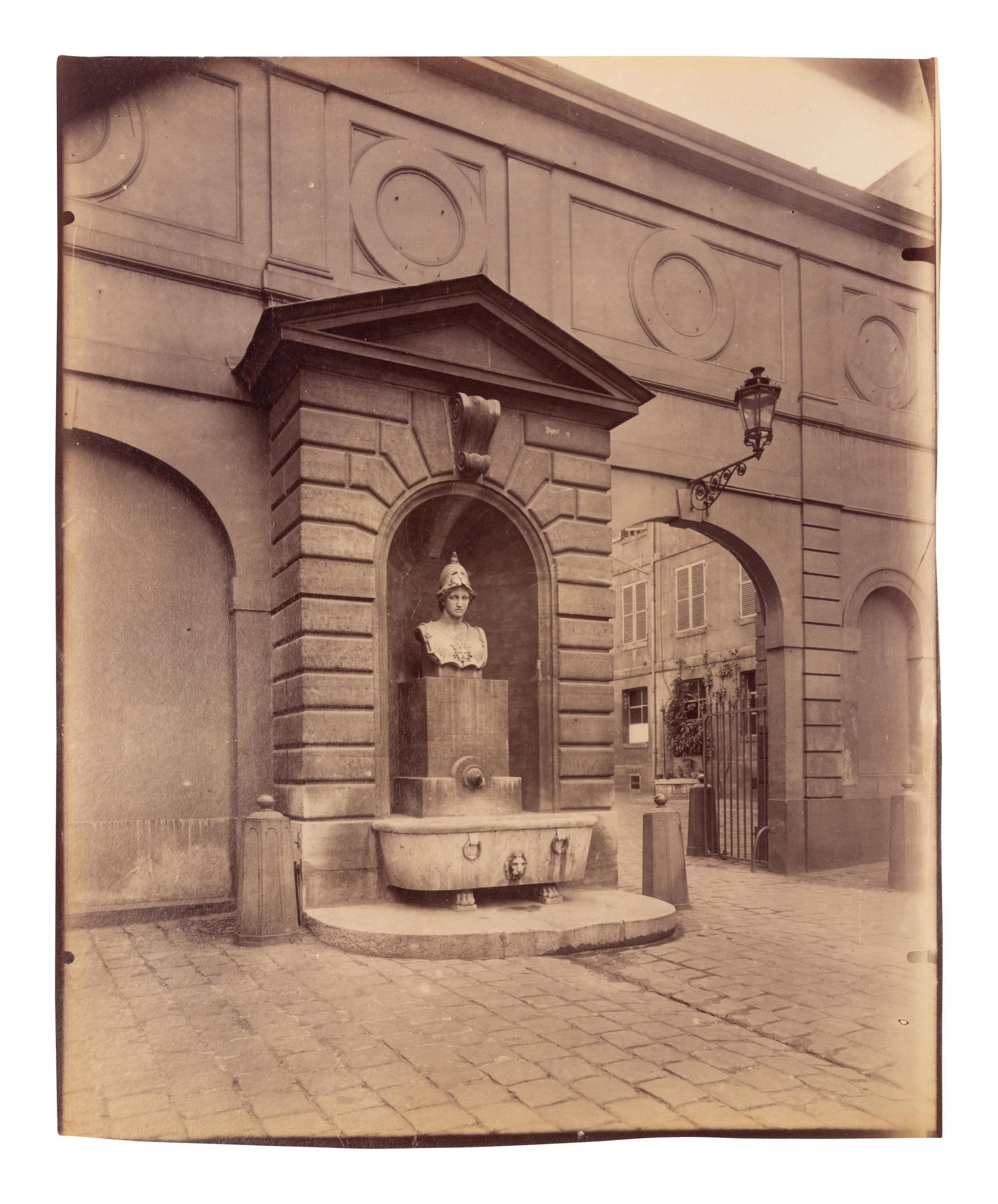 A pair of photographs depicting fountains ( Fontaine Minerve, Institut , 1899; Fontaine du Marché Saint-Honoré , 1903)