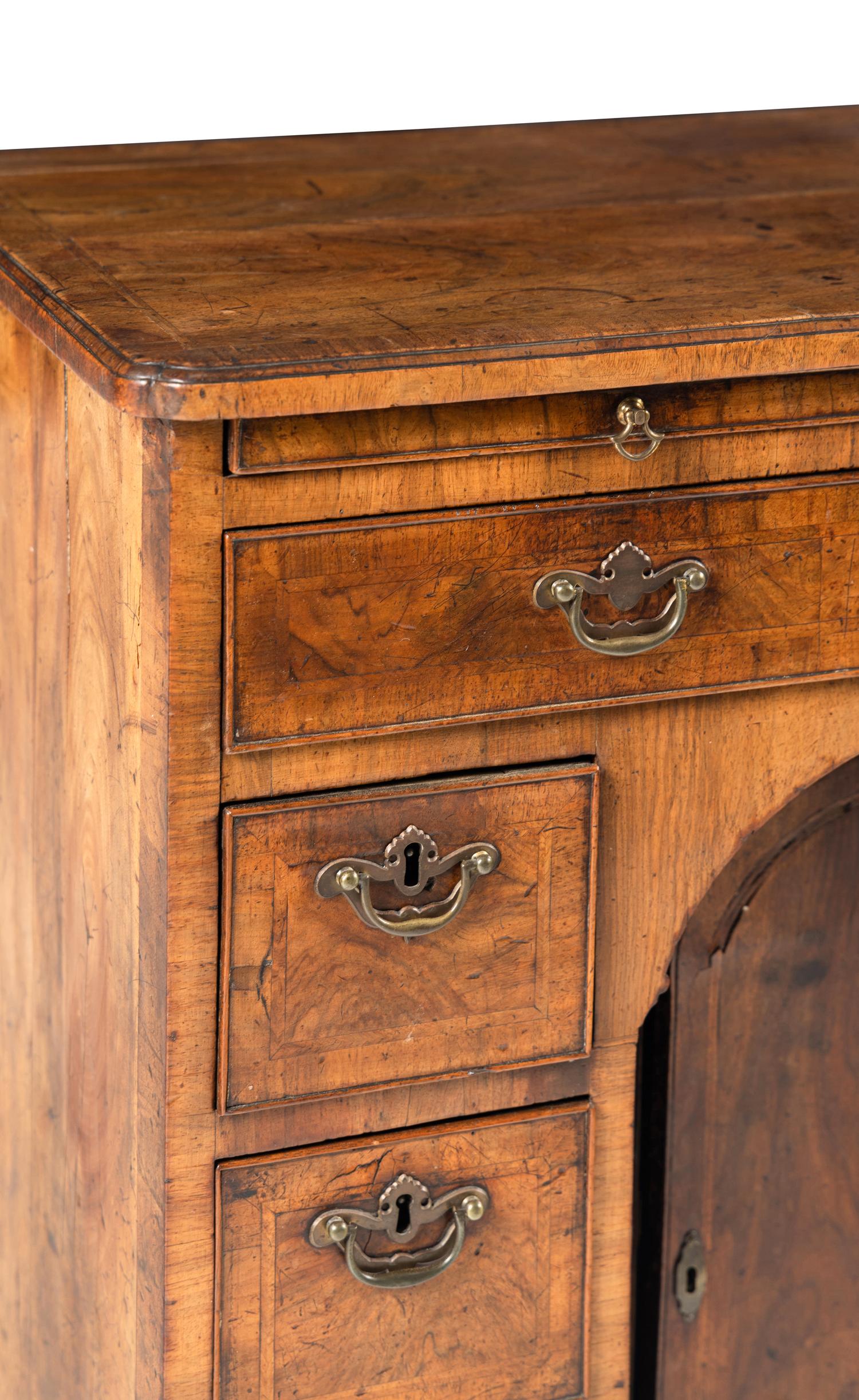 A George I Walnut Kneehole Desk