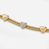 An 18K Tri-Color Gold and Diamond Bracelet