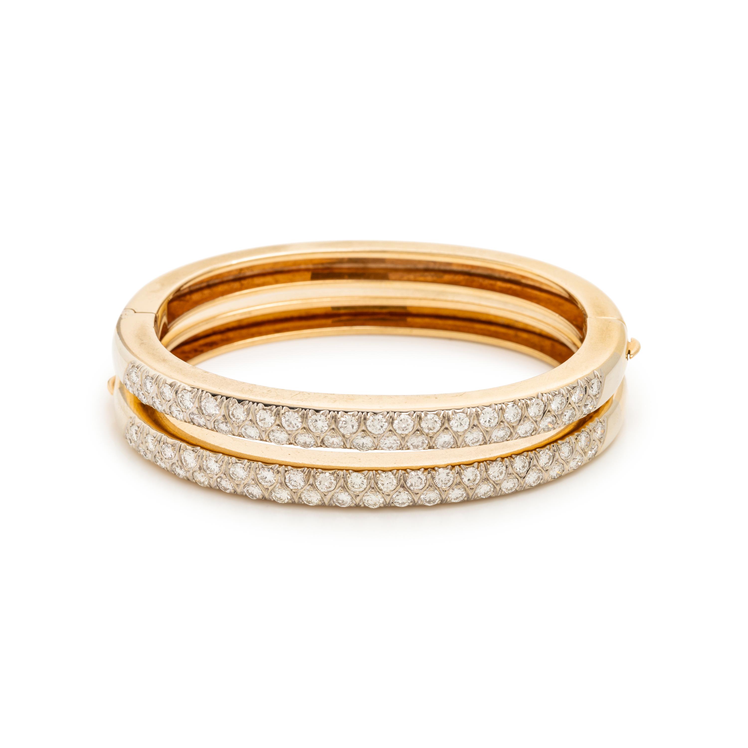 PAIR OF BICOLOR GOLD AND DIAMOND BANGLE BRACELETS