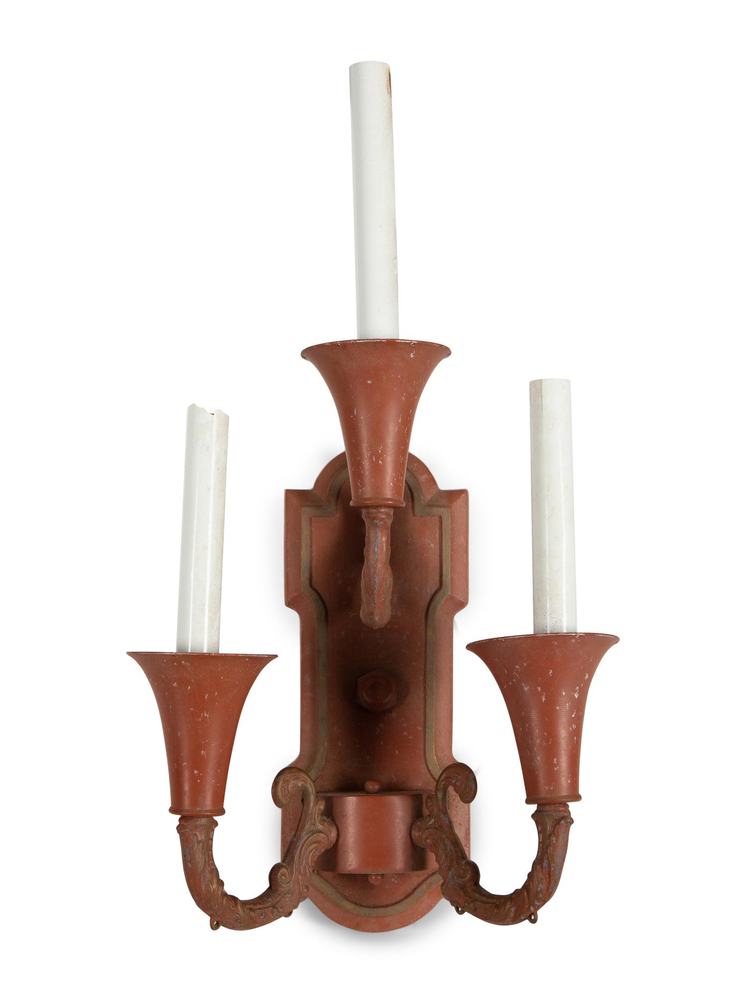 A Pair of Red and Gilt Decorated Tole Three-Light Wall Sconces