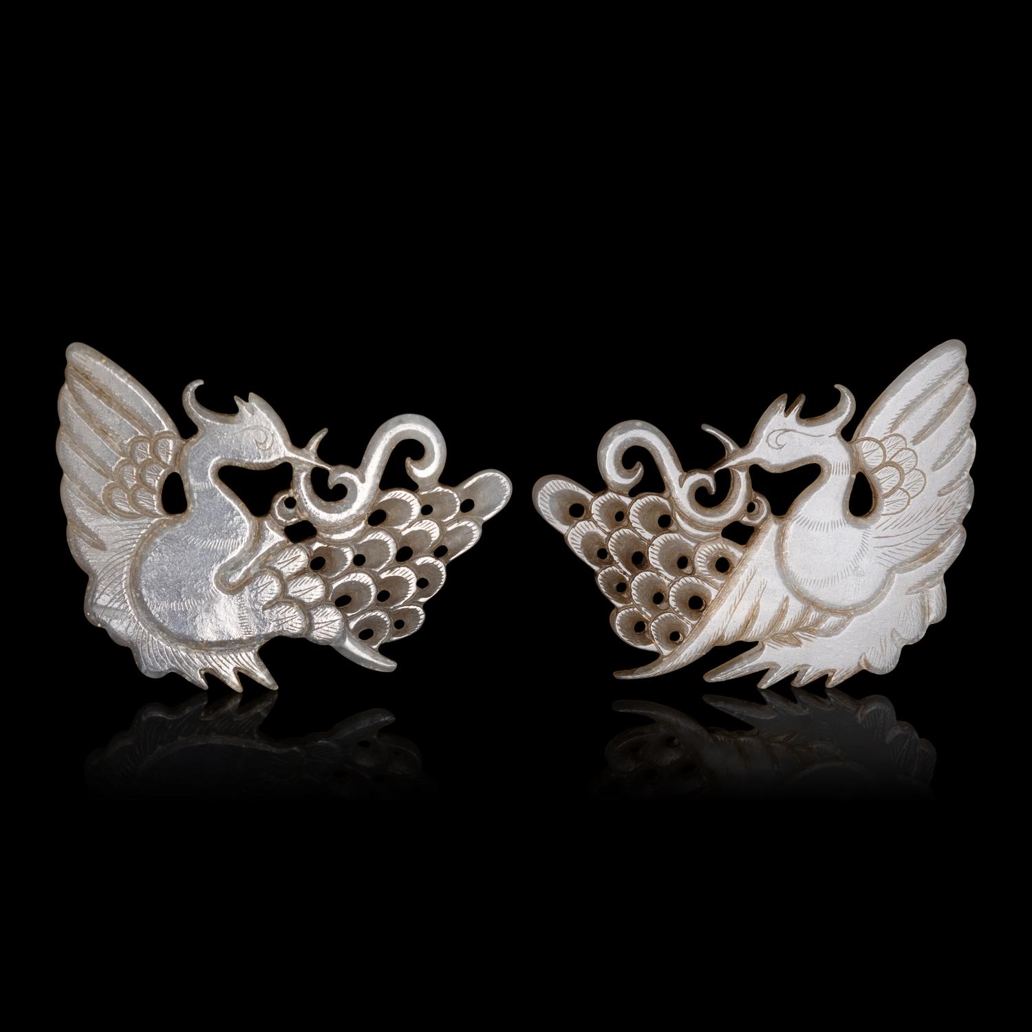 A Pair of Chinese Pale Celadon Jade 'Peacock' Hat Ornaments, Jin Dynasty 金 白玉孔雀珮一對