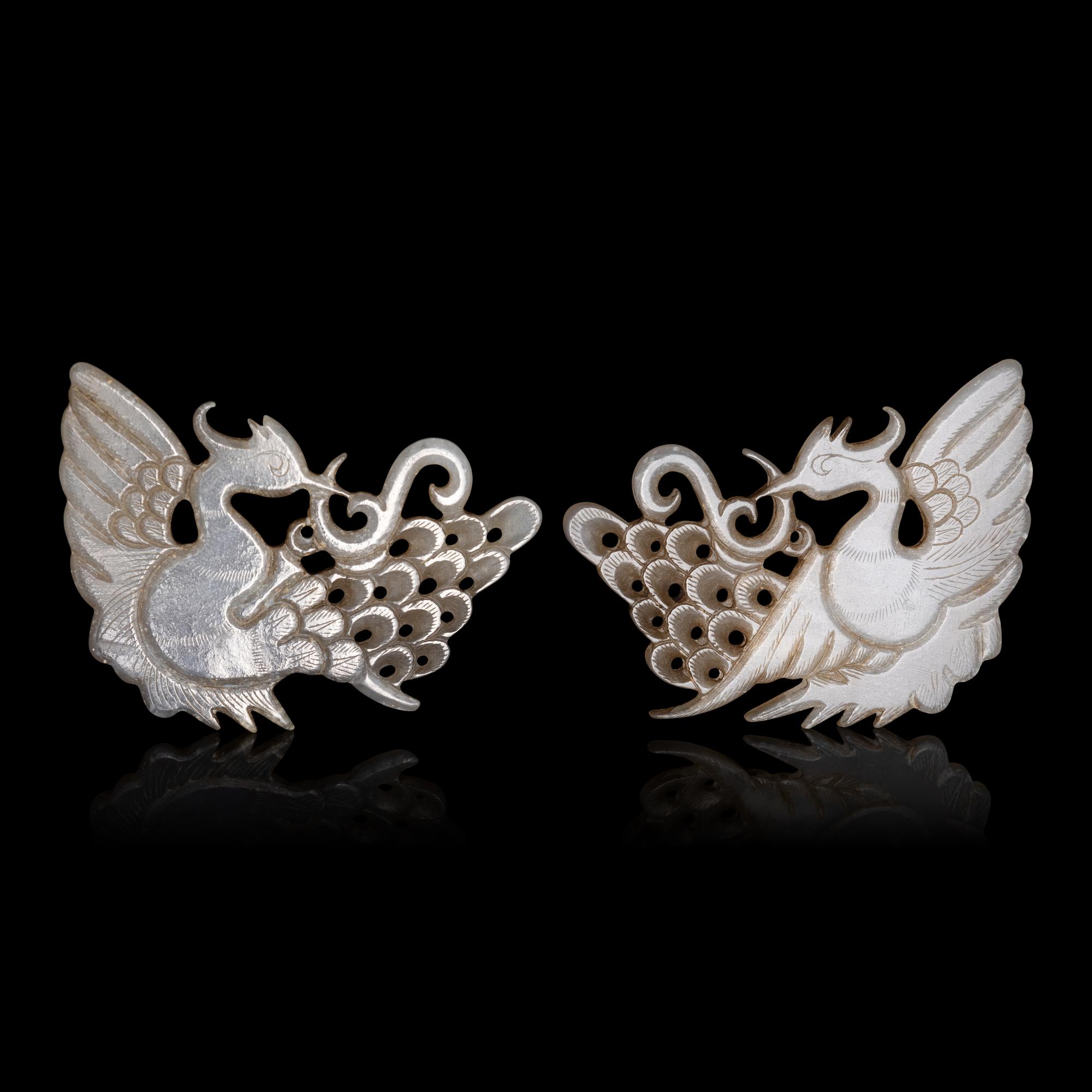 A Pair of Chinese Pale Celadon Jade 'Peacock' Hat Ornaments, Jin Dynasty 金 白玉孔雀珮一對