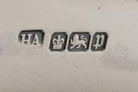 A Group of Four English Silver Table Articles
