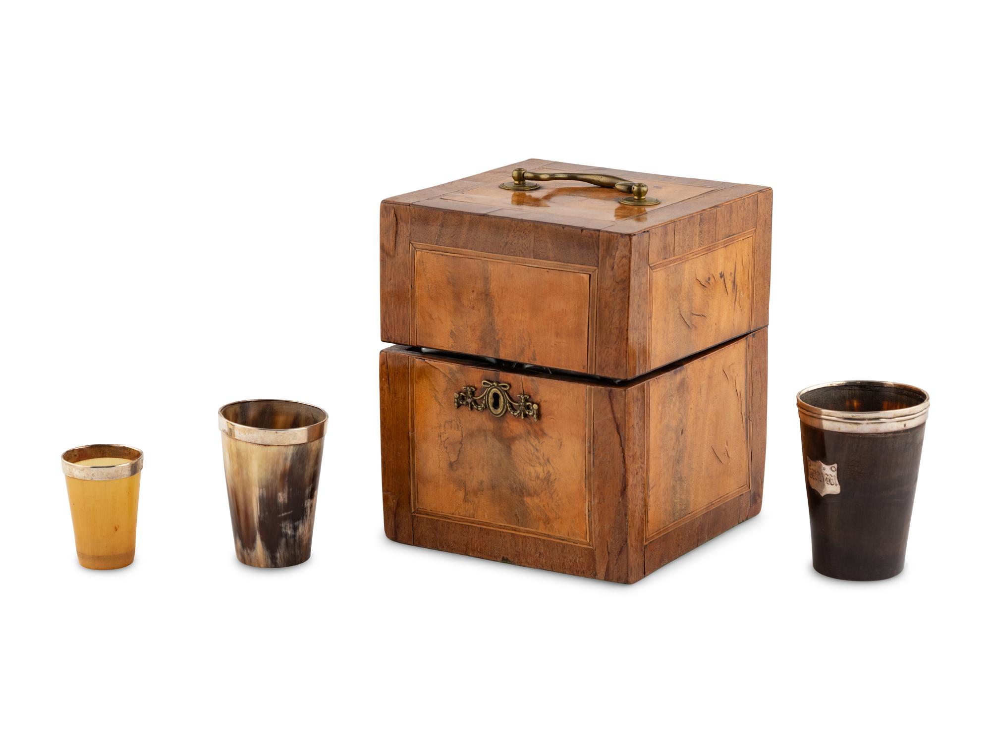 A Walnut and Mahogany Tantalus and Three Silver-Mounted Horn Tumblers