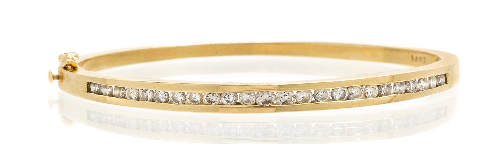 A 14 Karat Yellow Gold and Diamond Bangle Bracelet, 12.70 dwts.