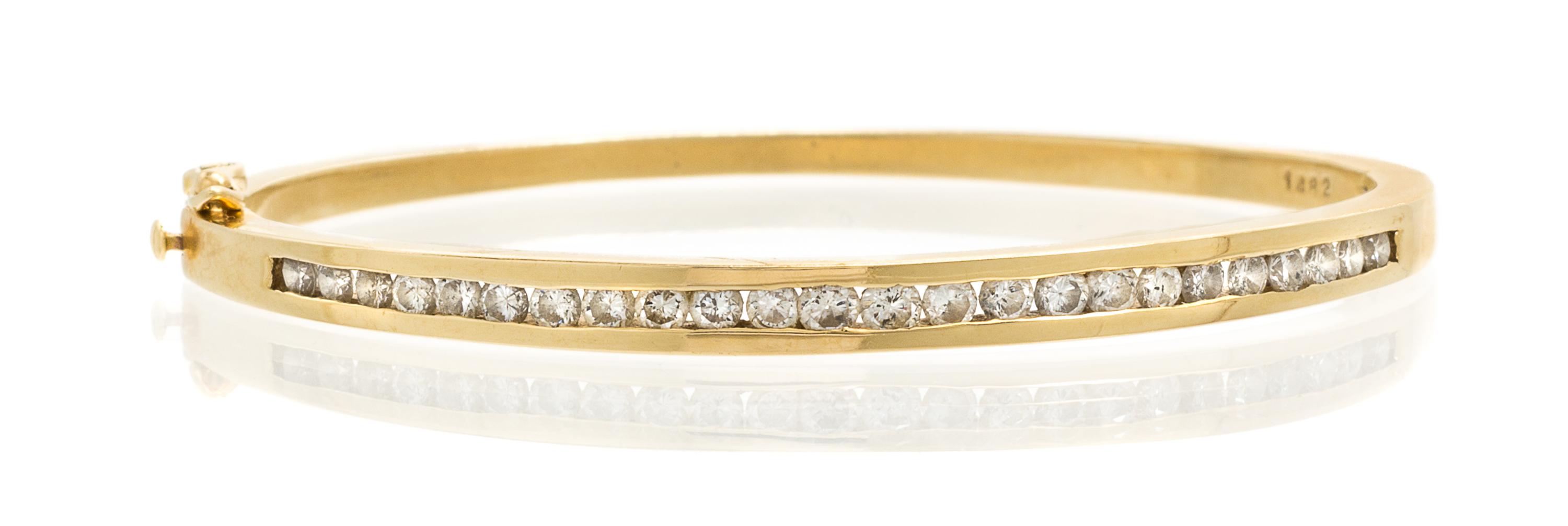 A 14 Karat Yellow Gold and Diamond Bangle Bracelet, 12.70 dwts.