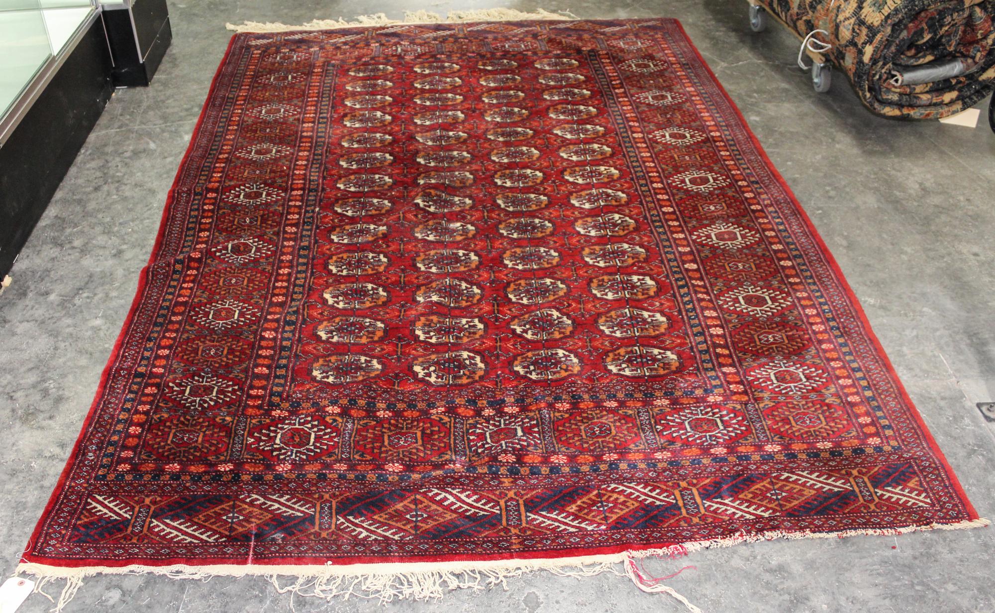 A Bokhara Wool Rug 8 feet 10 inches x 5 feet 1 inch.