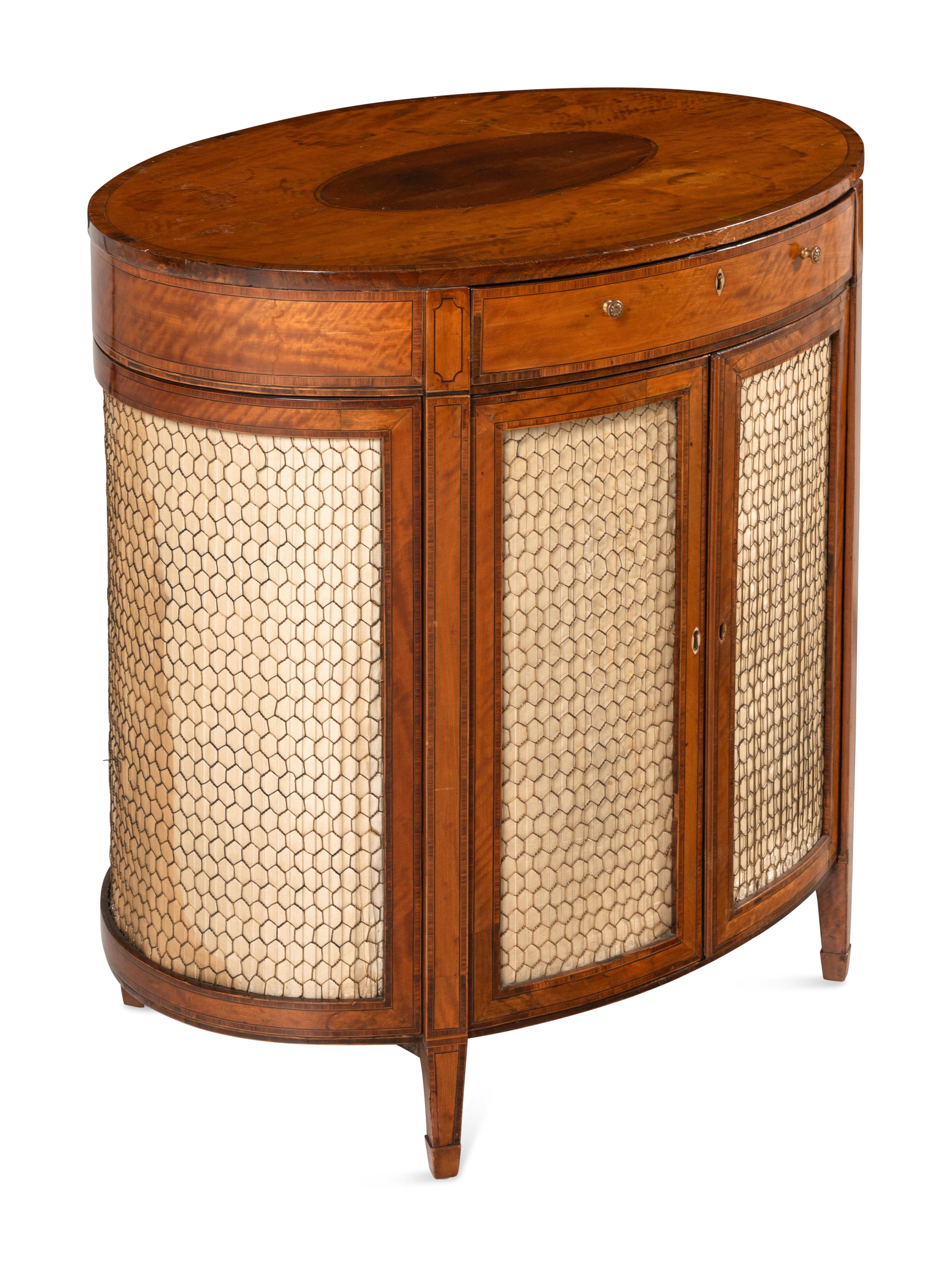 A George III Satinwood and Mahogany Oval Cabinet