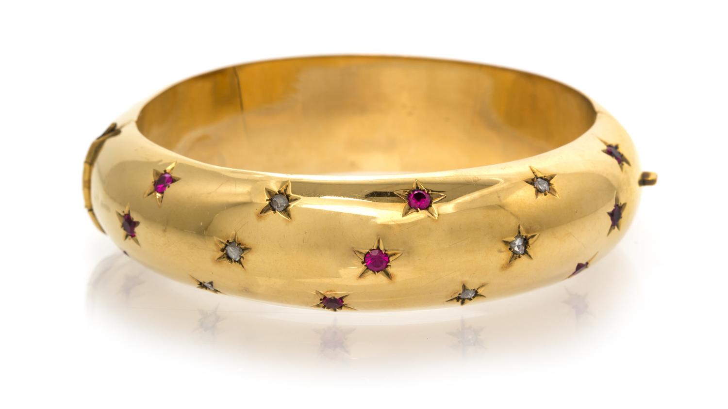 An 18 Karat Yellow Gold, Ruby and Diamond Bangle Bracelet, 18.90 dwts.