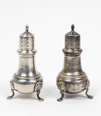 A Pair of American Silver Casters, Hunt Silver Company, Chicago, IL, 20th Century, having a pierced top with a baluster body and raised