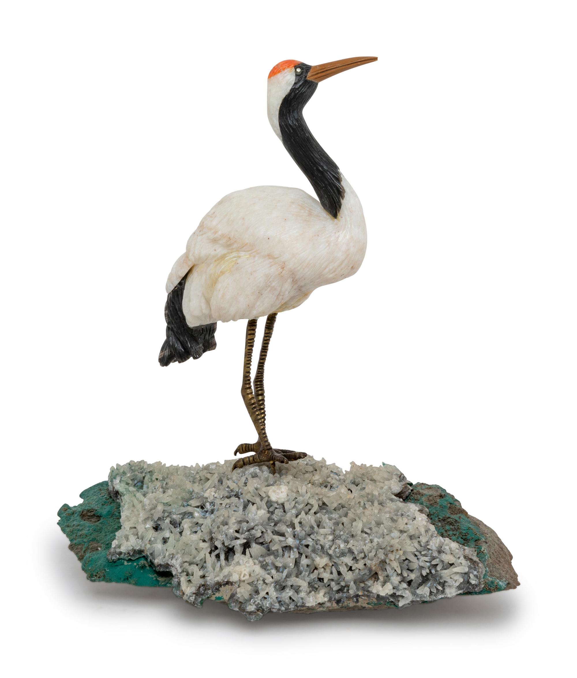 A Carved White Dolomite, Obsidian, and Coral Figure of a Red-Crowned Crane