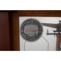 A Central Scientific Co. Scale, an Ingraham Eight-Day Movement Mantle Clock and Framed Salesmen Samples of Blue Grass Axes