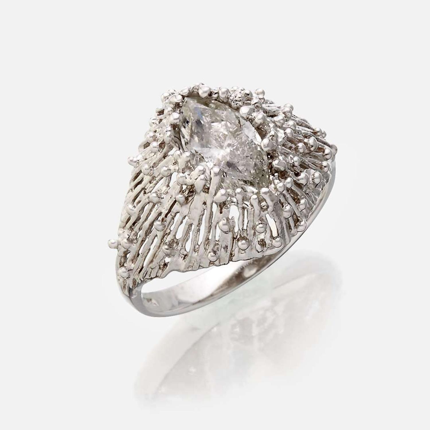 An eighteen karat gold and diamond ring