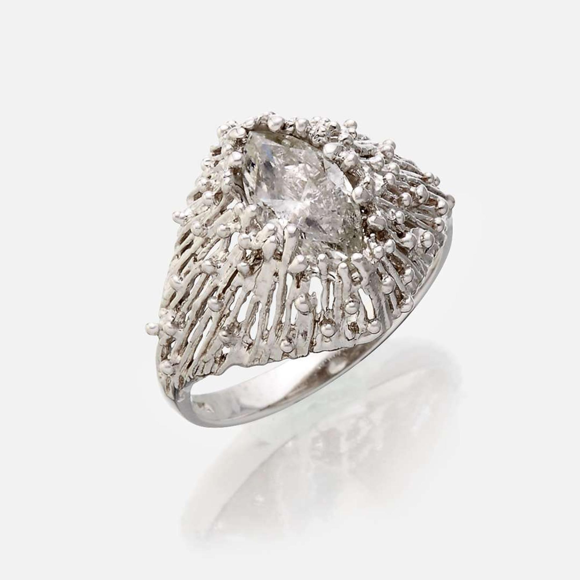 An eighteen karat gold and diamond ring