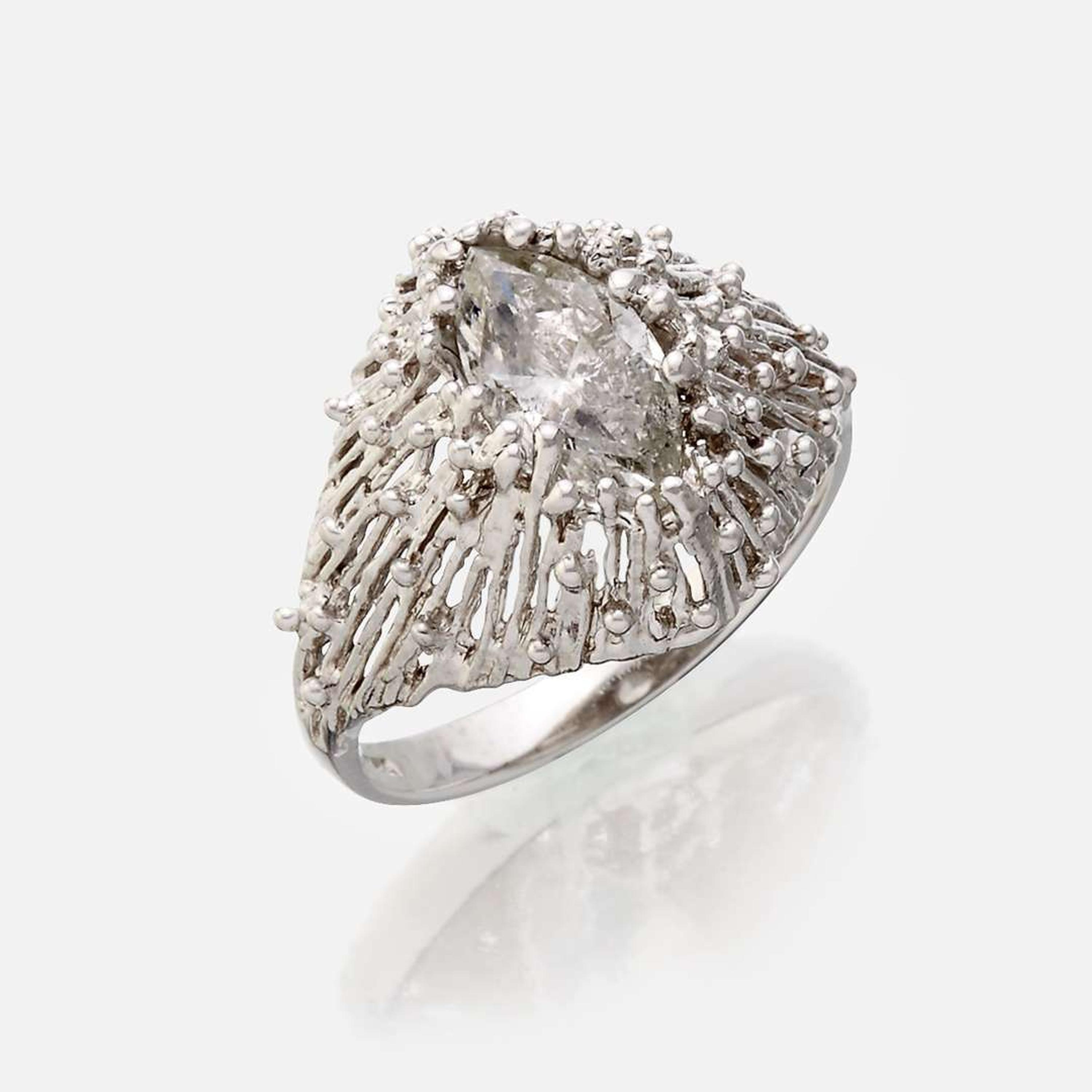 An eighteen karat gold and diamond ring