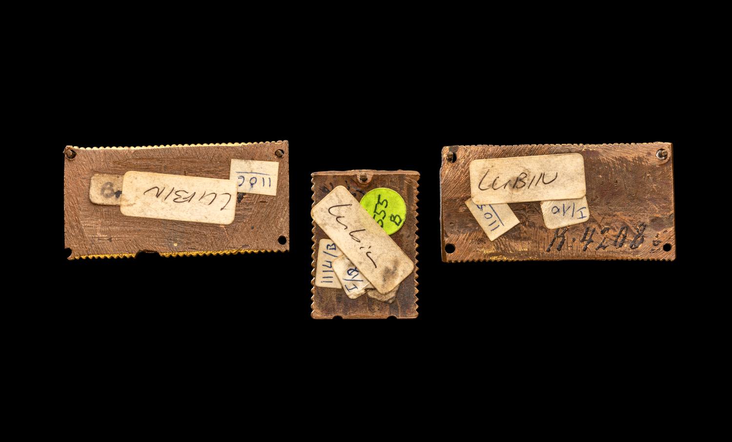 Three Rhenish Champlevé and Gilt Copper Framing Plaques