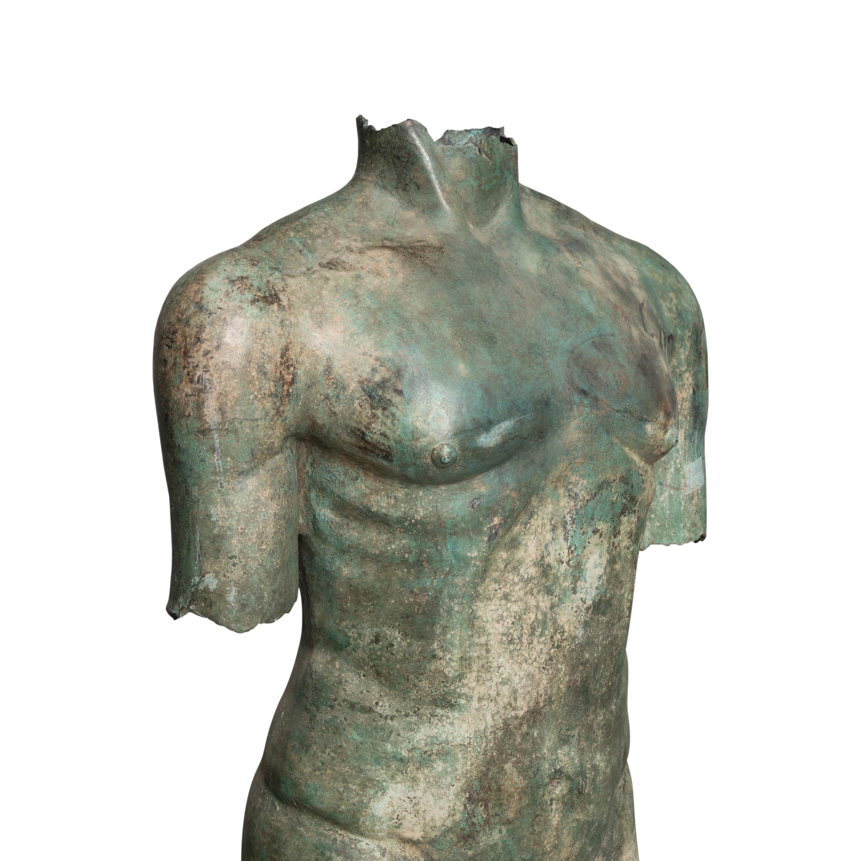 A Patinated Bronze Torso on Stone Plinth