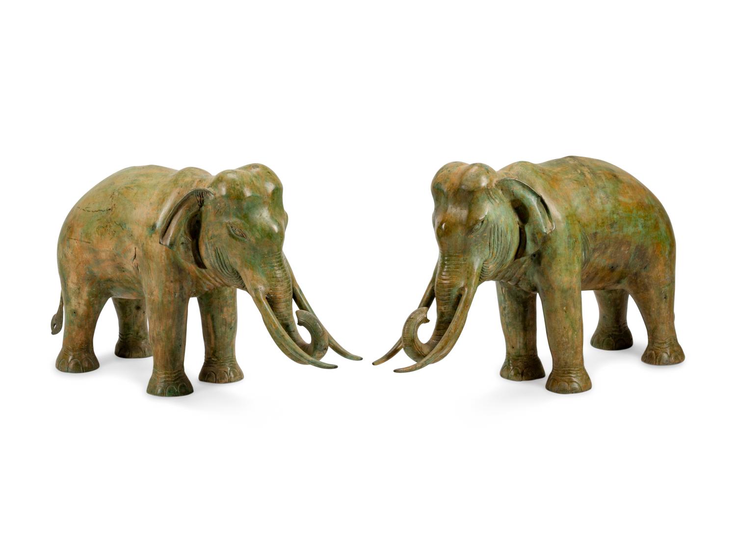 A Large Pair of Patinated Bronze Elephants