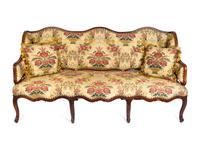 A Louis XV Provincial Walnut and Oak Canapé à Oreilles — THIRD QUARTER 18TH CENTURY