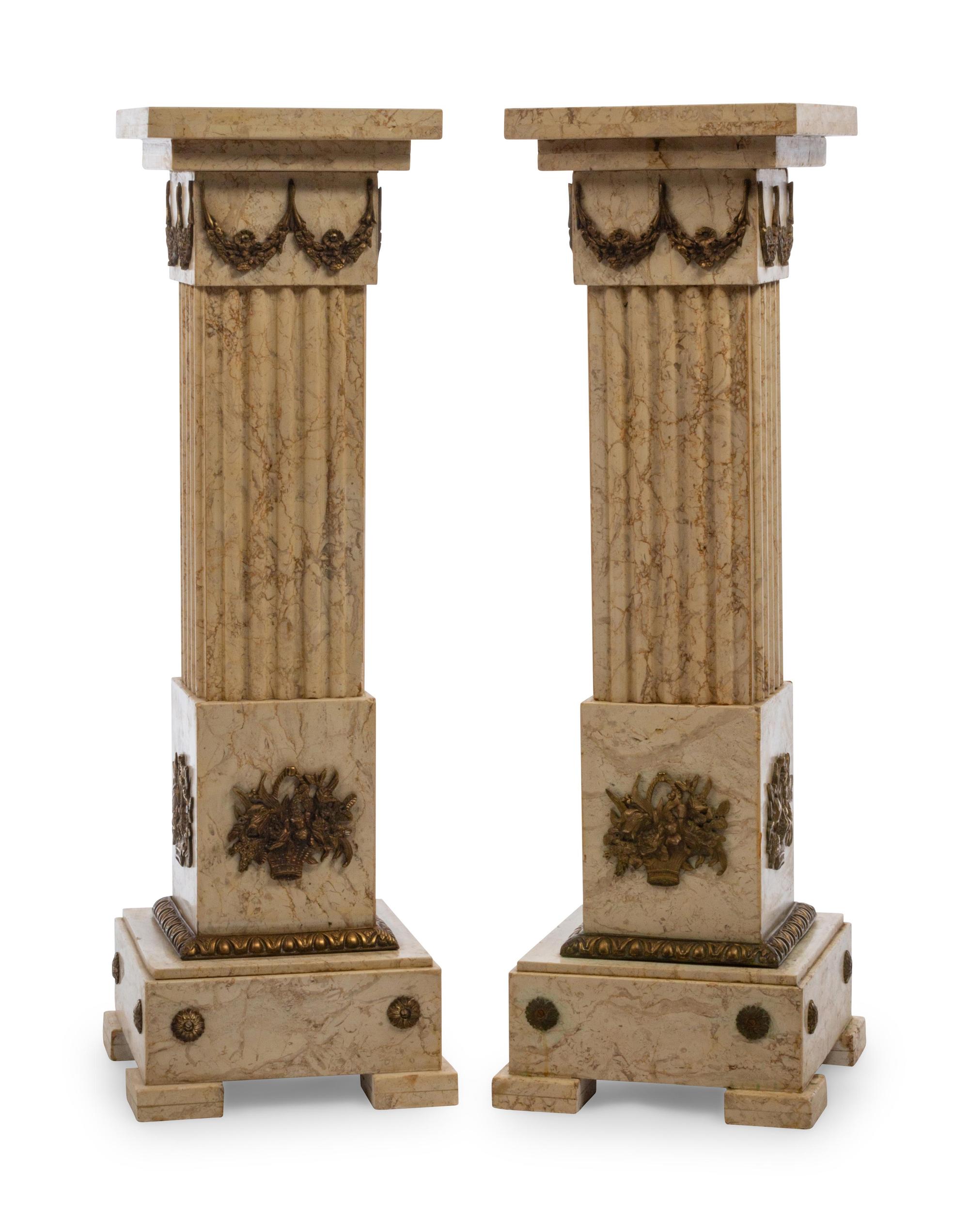 A Pair of Louis XVI Style Gilt Metal Mounted Marble Pedestals