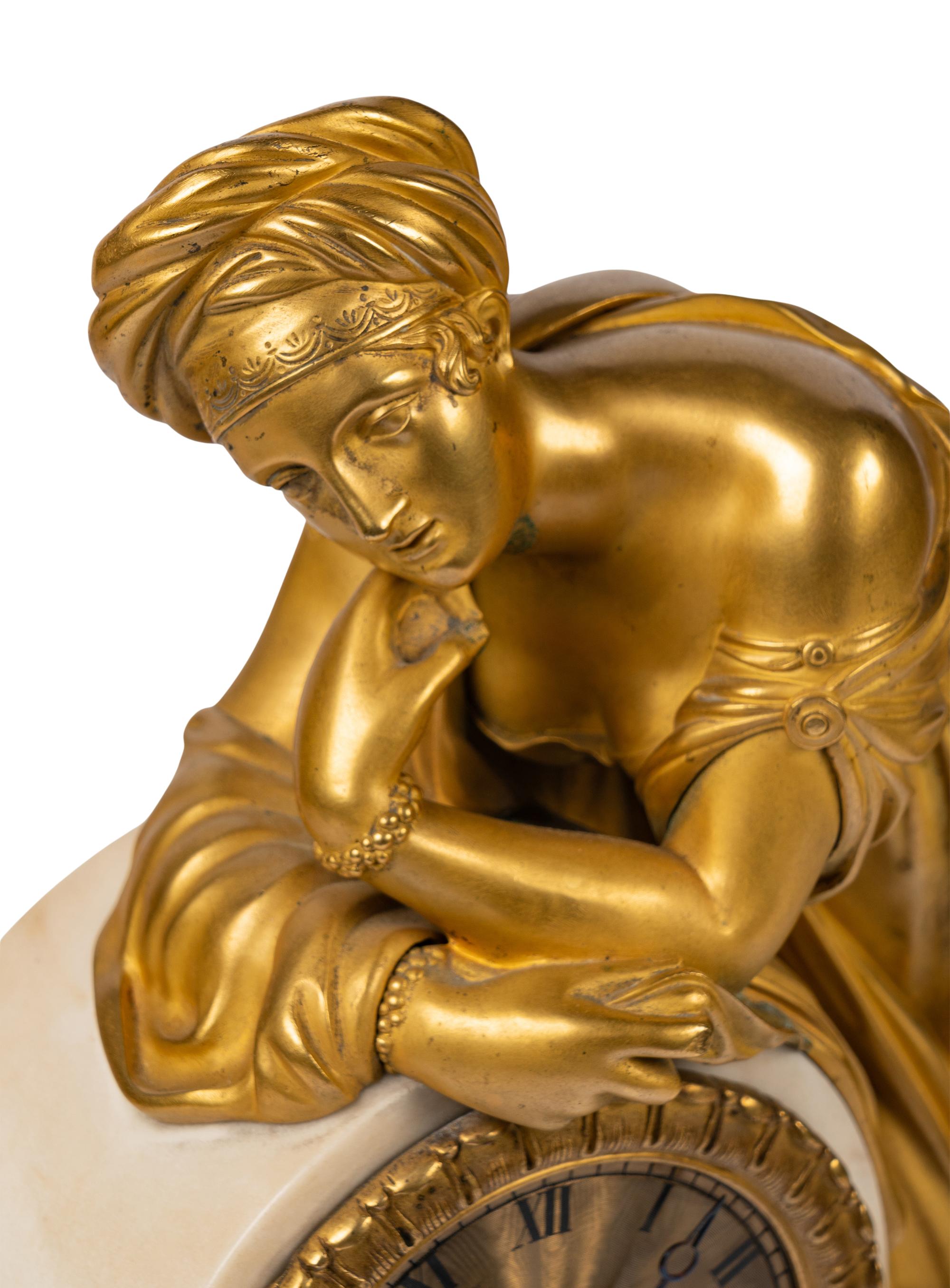 A Louis Philippe Gilt Bronze and White Marble Mantel Clock