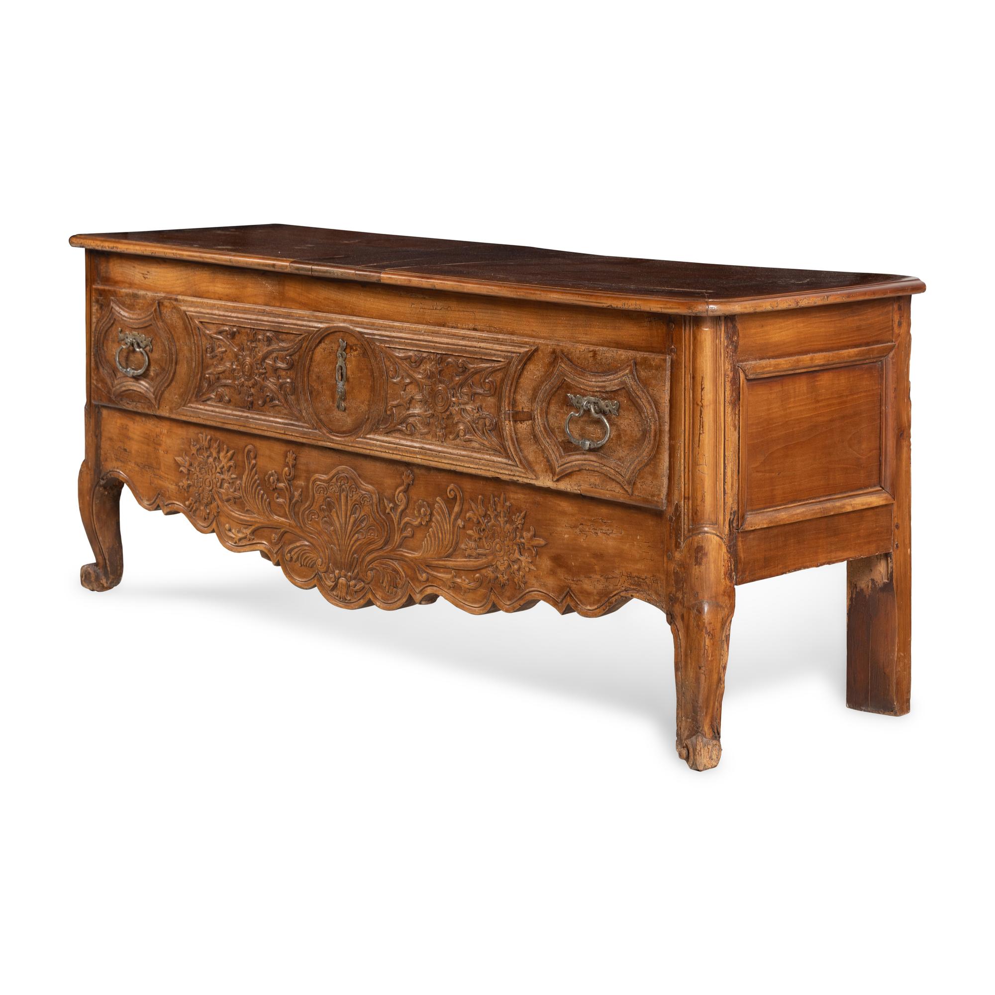 A French Provincial Carved Walnut Lift-Top Chest