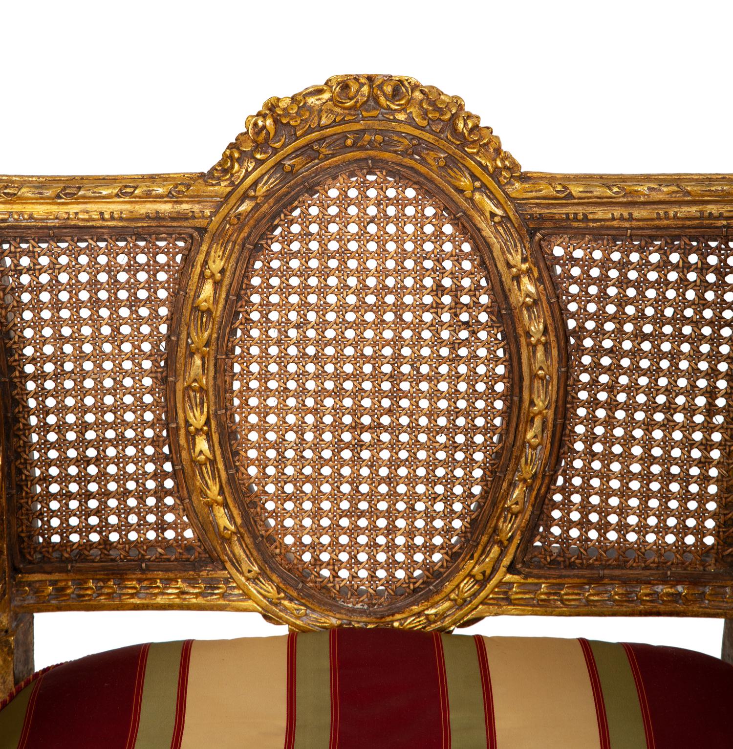 A Pair of Louis XVI Style Giltwood Cane-Back Benches