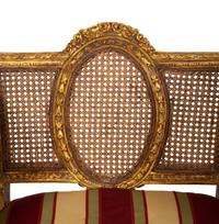 A Pair of Louis XVI Style Giltwood Cane-Back Benches