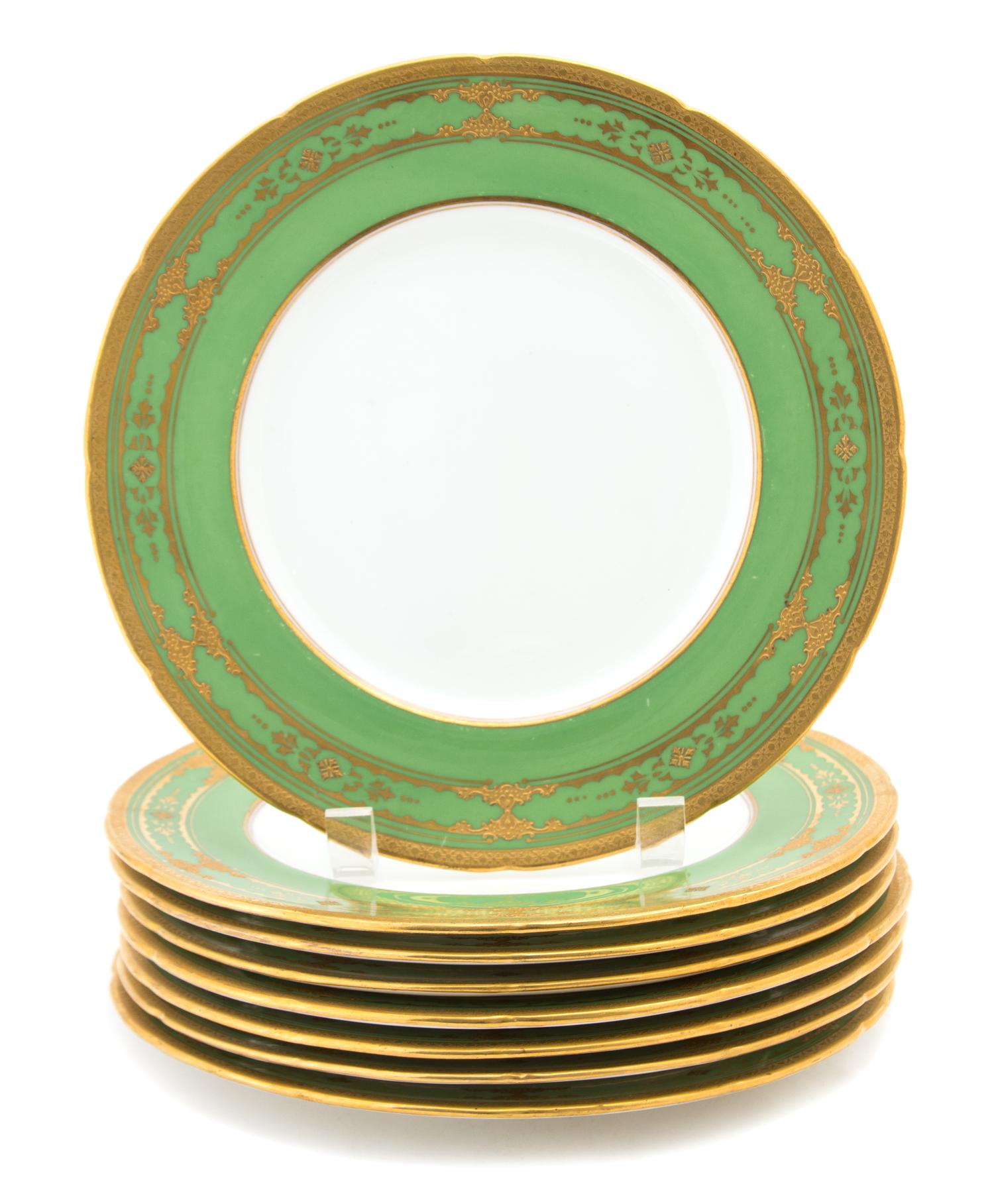 A Group of Eight Coalport Porcelain Plates with Apple Green and Gilt Border Diameter 9 inches.