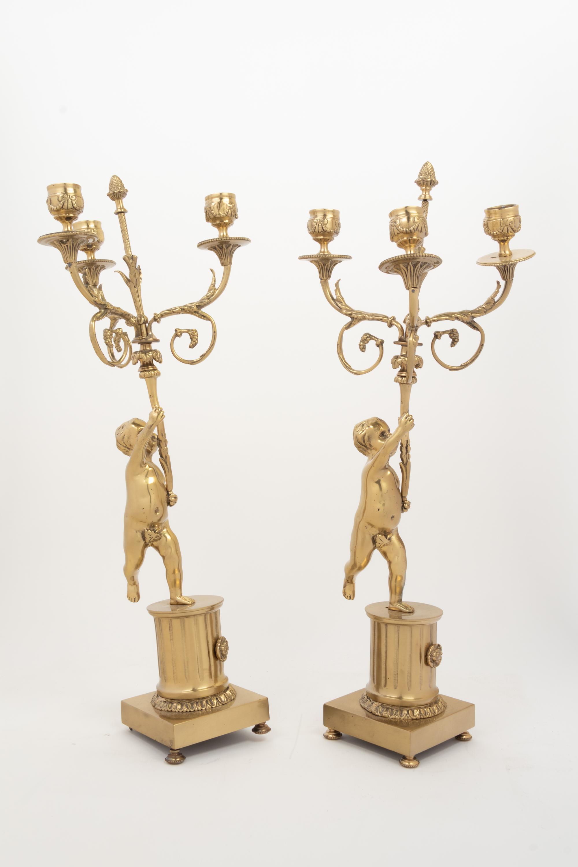 A Pair of Louis XV Style Gilt Metal Three-Light Candelabra