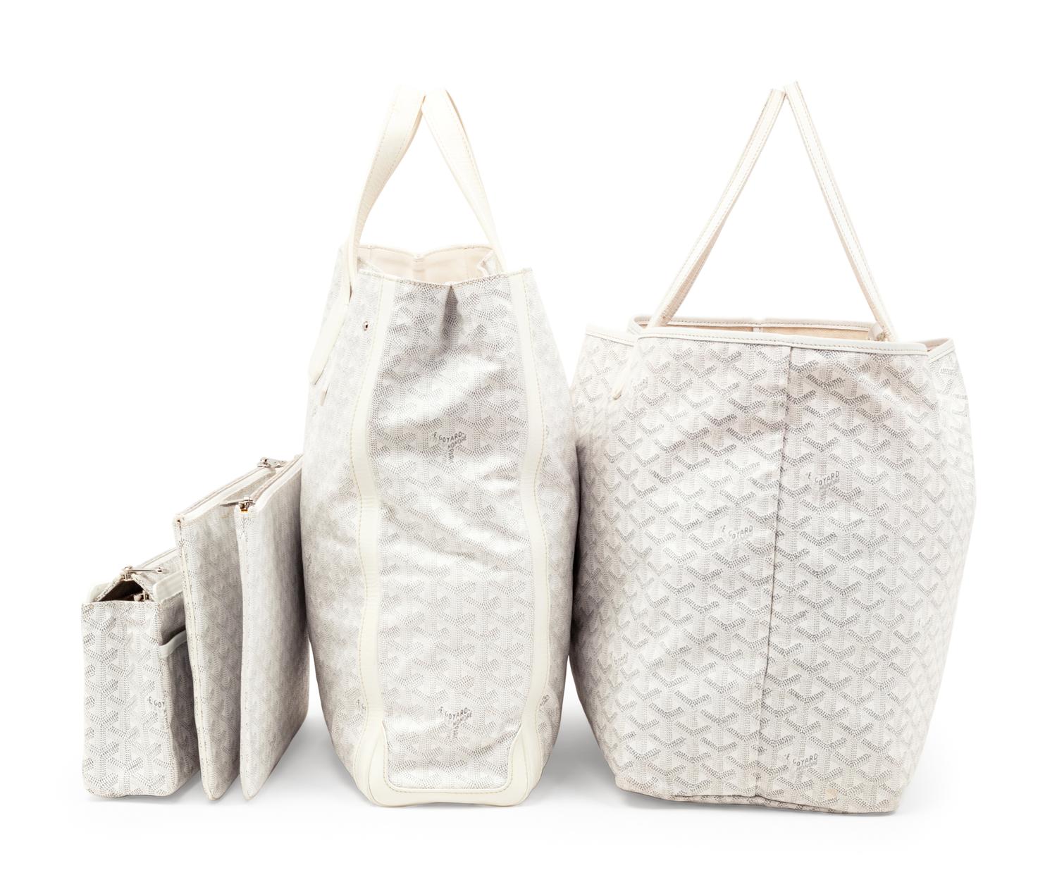 Six Goyard Items: Two Totes, Three Pouches, and One Wallet
