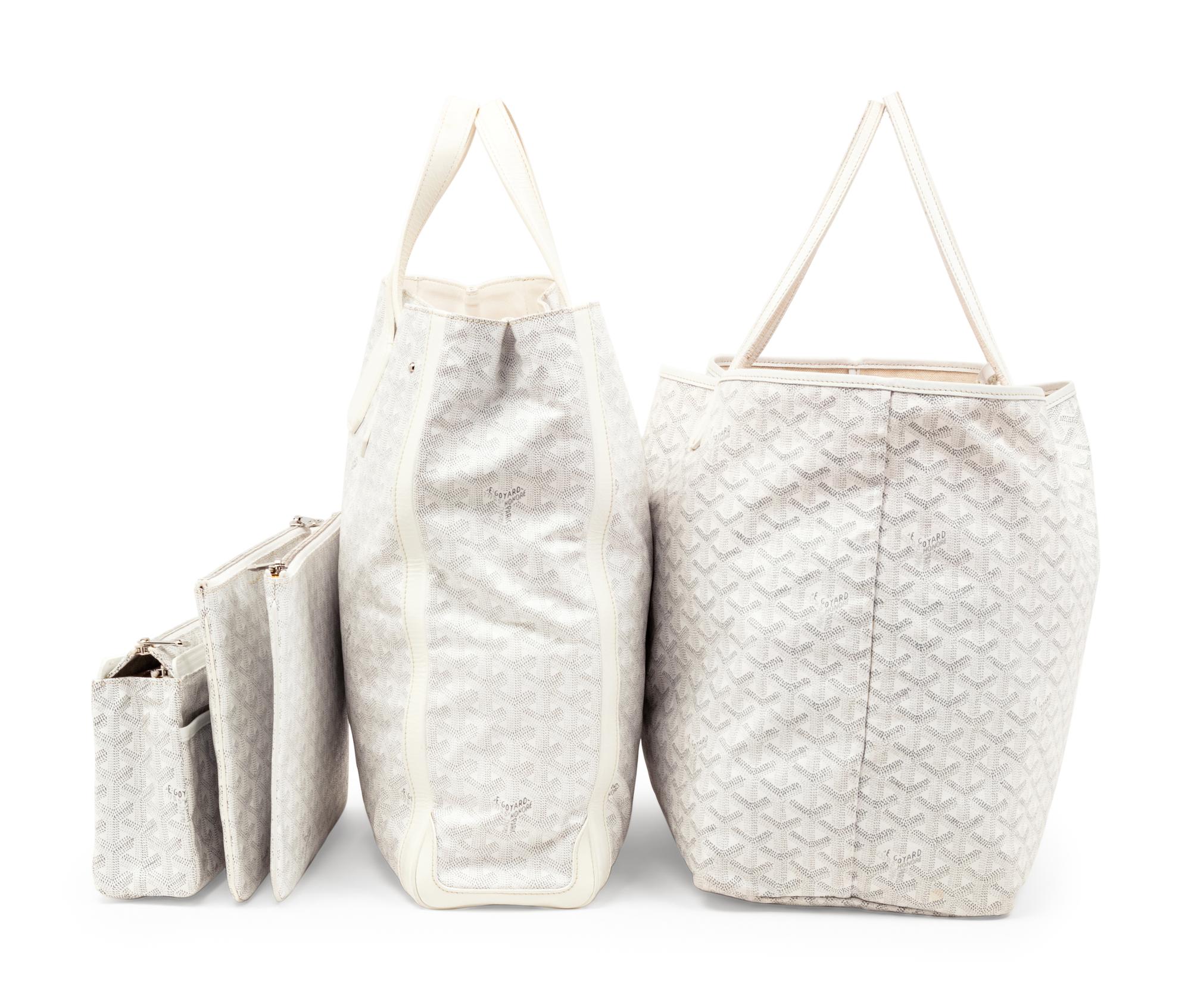 Six Goyard Items: Two Totes, Three Pouches, and One Wallet